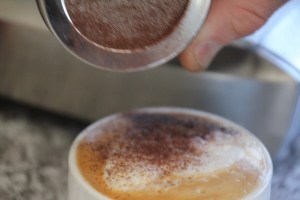 chocolate-being-sprinkled-on-capuccino