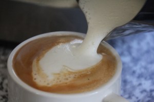 frothy-milk-pour-into-espresso-coffee